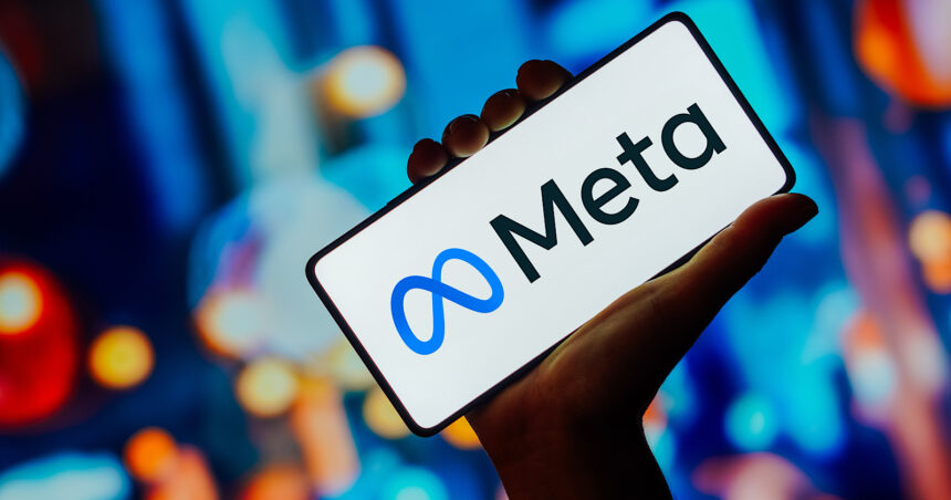 In this photo illustration, the Meta Platforms logo is displayed on a smartphone screen