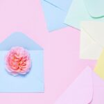 An assortment of greeting cards and envelopes on a flat background.