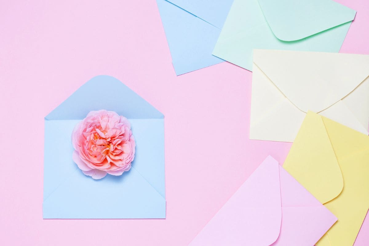 An assortment of greeting cards and envelopes on a flat background.