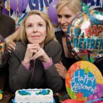 Content white businesswoman being congratulated by colleagues at her retirement party
