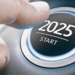 Finger pressing a car ignition button with the text 2025 start.