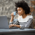 Woman taking surveys with User Interviews on her laptop
