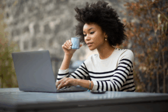 Woman taking surveys with User Interviews on her laptop