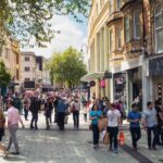 Queen Street, one of Cardiff's main shopping streets, busy with Saturday shoppers.