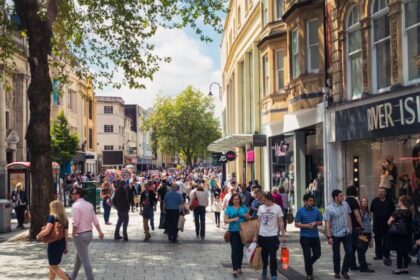Queen Street, one of Cardiff's main shopping streets, busy with Saturday shoppers.