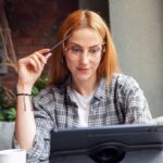 A woman searching for jobs on a laptop.
