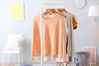 A clothing rack, featuring an assortment of trendy women's clothes.